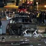 Burnt out car with Damien Darhk (Neal McDonough) & his stunt double in the background