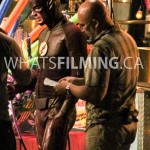 Grant Gustin and Director Kim Miles discussing the scene