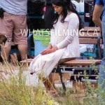 An upset Princess Jasmine sits alone on a bench