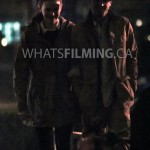 Caitlin Snow and Julian Albert lock arms as they walk while filming a scene for The Flash season 3 episode 13 in Vancouver
